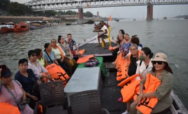 Tourists enjoying boat ride on Ganga in Varanasi