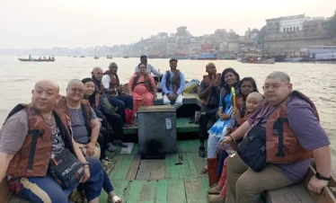 Tourists enjoying boat ride on Ganga in Varanasi